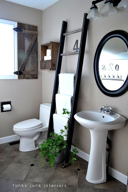 A bathroom with a ladder… and a famous toilet paper crate