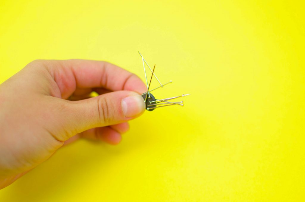 use a magnet to pick up loose pins in your sewing room