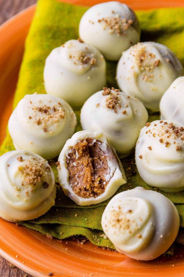 Pumpkin spice truffles coated with white chocolate and sprinkled with graham cracker crumbs