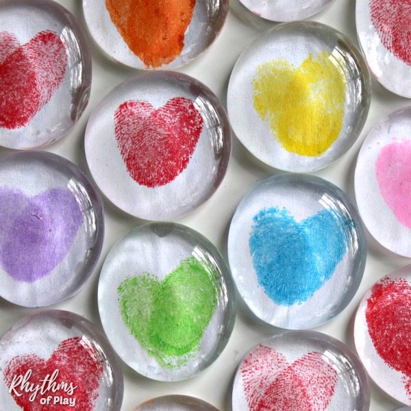 Colorful fingerprint art glass magnets an easy craft perfect for stocking stuffer