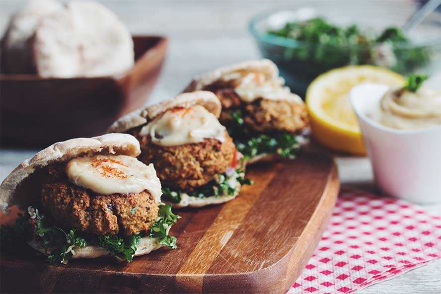 Baked falafel sliders served with tangy tabbouleh salad and a lot of tahini sauce