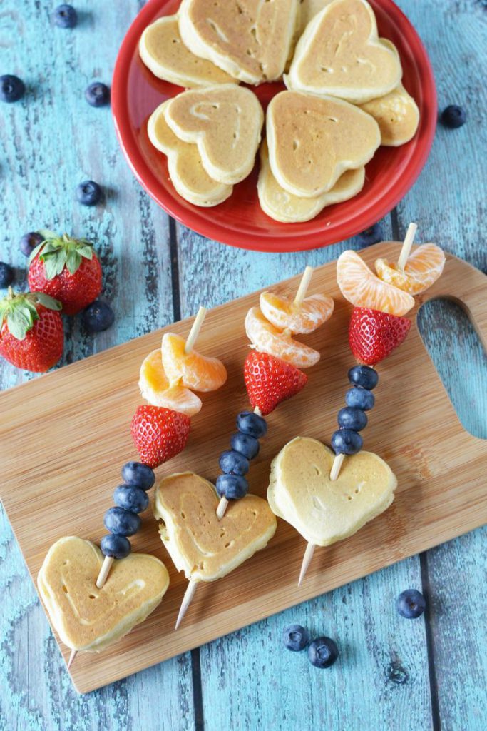 Valentine’s Day Cupid Arrow Pancake Kabobs made using fresh fruits, and heart-shaped pancakes