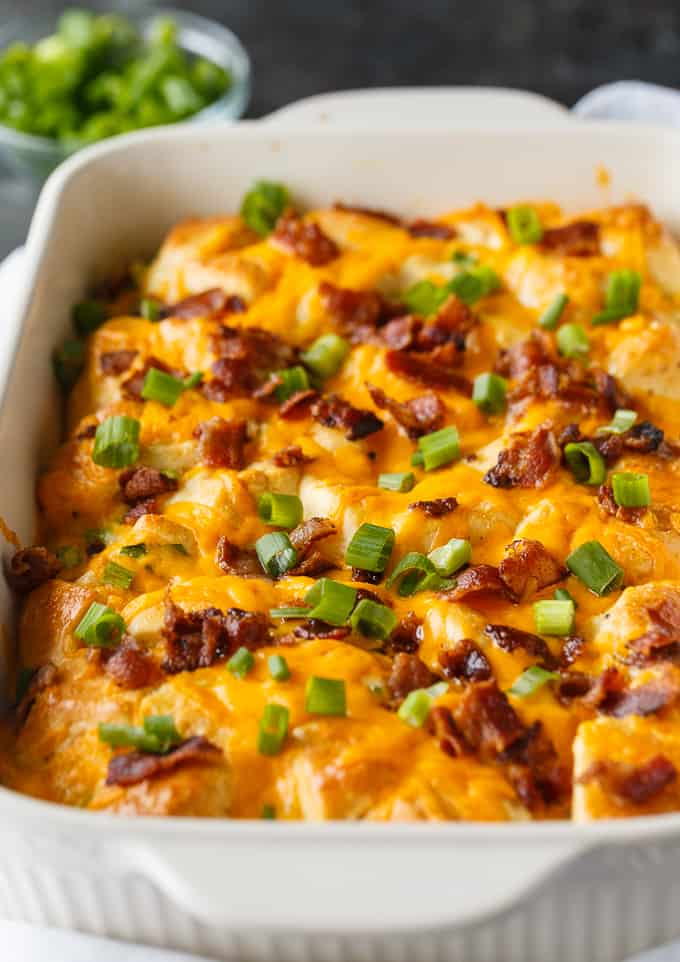 Bacon, egg, and biscuit casserole topped with sliced green onions.