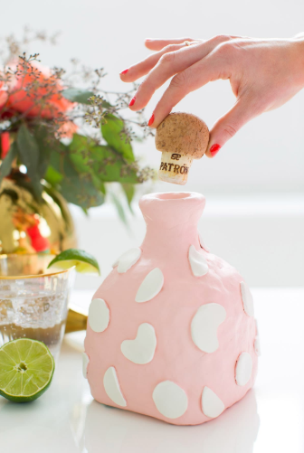 diy air dry clay decanter formed around an empty bottle