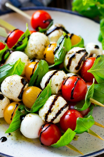 caprese skewers combine tomatoes with basil, mozzarella, olive oil and balsamic