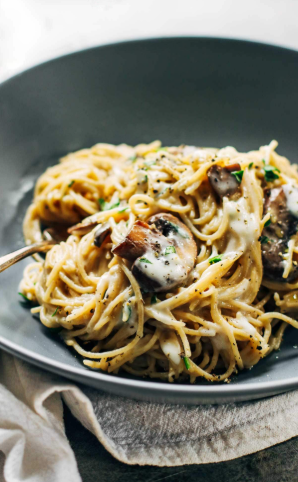 Mushroom spaghetti with a creamy garlic herb sauce