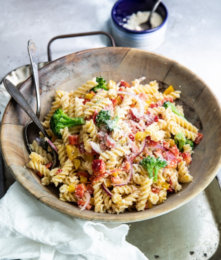 Simple, but scrumptious cold pasta salad that has broccoli, bell peppers, zesty Italian dressing and Parmesan cheese