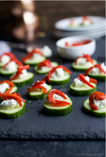 Fresh and simple cucumber bites topped with a zesty Herb Cream Cheese and sweet Piquillo Peppers