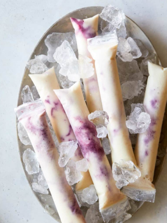 A delicious Italian ice pops summer treat made with blackberry, pineapple, and coconut swirl.