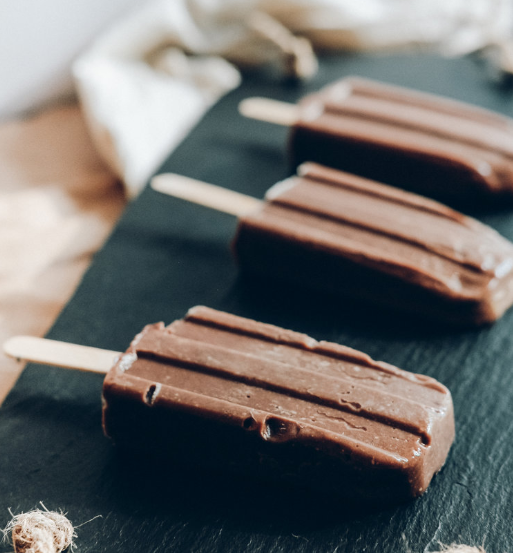 A vegan and gluten free fudgsicle cold treat creamy chocolate ice pops made with arrowroot