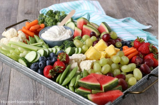 Charcuterie board with delicious and healthy fruits and vegetables perfect for parties