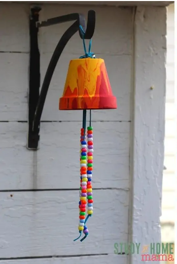 A garden wind chimes using a flower pot and has a string beads
