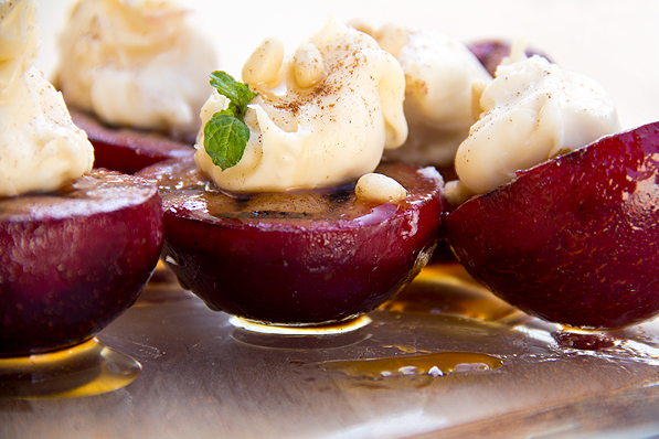 Grilled cinnamon plums with sweetened mascarpone, vanilla honey and toasted pine nuts
