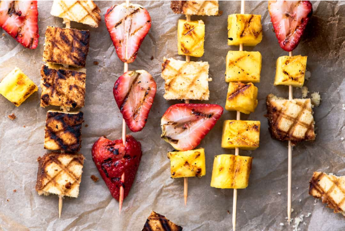 Grilled strawberries, bananas, and coconut pound cake skewers