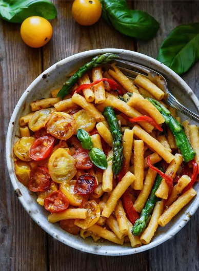 A delicious and easy to prepare pasta with asparagus, bell pepper, and tomato
