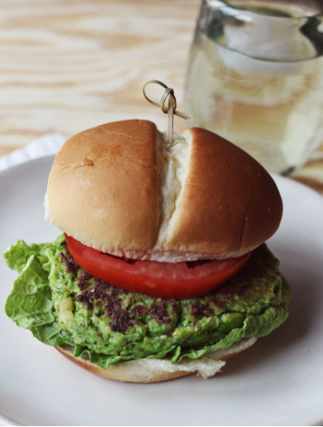 Spicy edamame burger with sliced of tomato