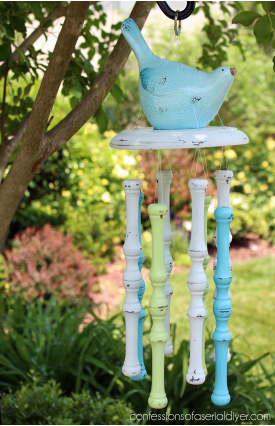 Spindle wind chimes with a bird as a top piece