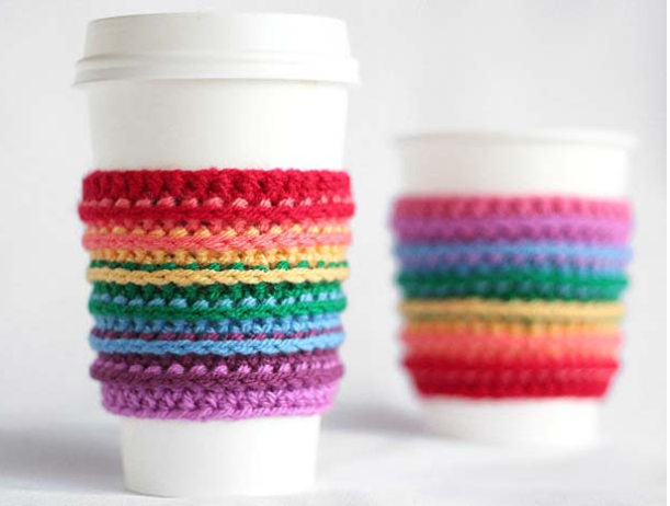 A crochet rainbow cup cozy