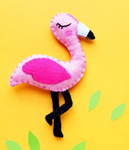 Felt plushie that looks like a pink flamingo