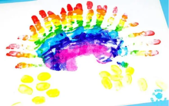 A handprint rainbow painting.