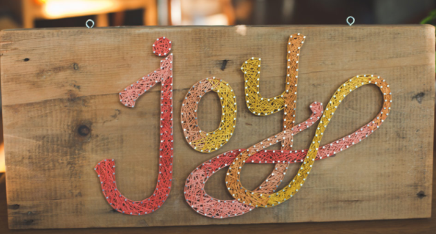 a beautiful joy string art sign