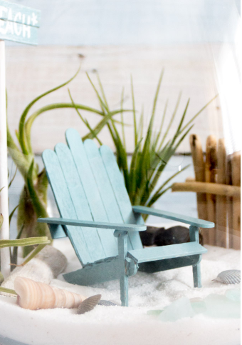 An adorable wooden mini adirondack chair crafts made of popsicle sticks