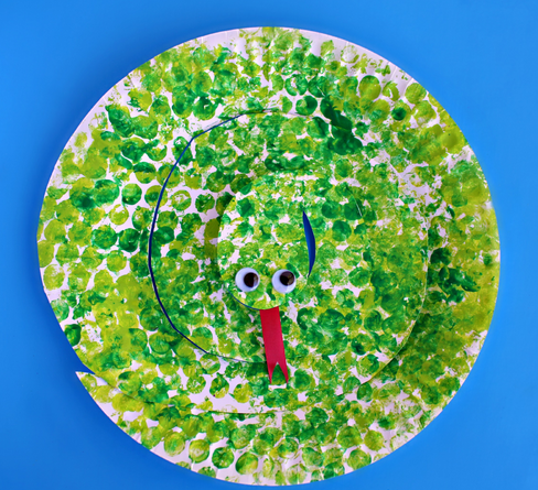Paper plate cut into a spiral shape then painted using a bubble wrap to make it looks like a snake