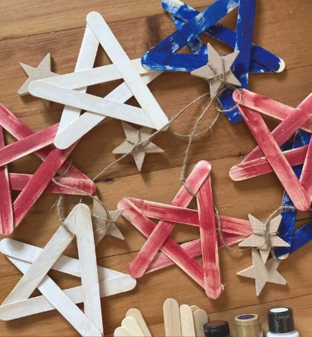 A red, white, and blue stars made of popsicle sticks a perfect craft to make with kids