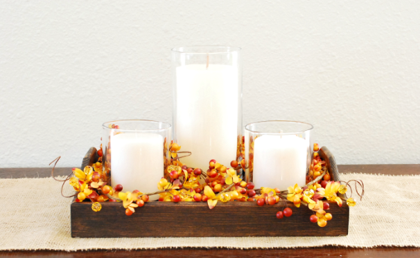 Fall candle with berry picks and garland centerpiece