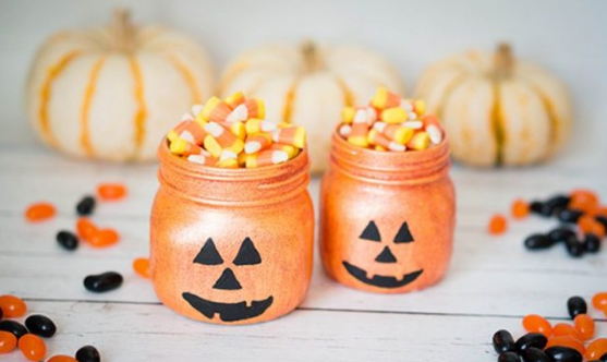 Glittery pumpkin jars full of  Halloween candy cones
