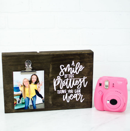 Iron on photo frame with a text saying ' A smile is the prettiest thing you can wear' is perfect for a lovely photo to display