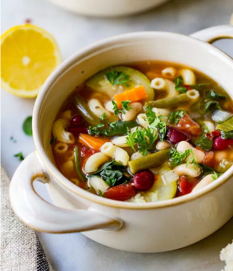 Slow cooker Minestrone soup loaded with fresh vegetables, beans, pasta and rich flavors of tomato and herbs.