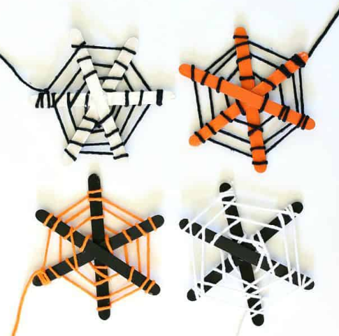 Popsicle sticks and yarn spider webs