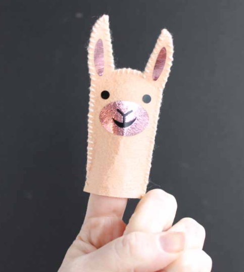 Smiling finger puppet llama