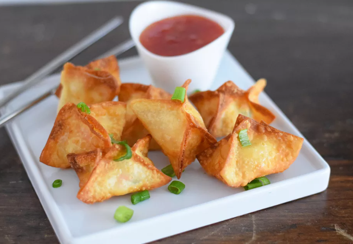 Fried crab Rangoon served with sweet and sour sauce