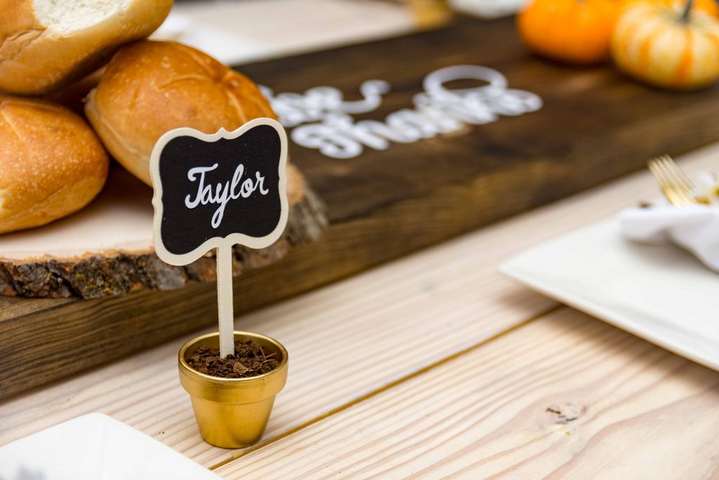 Chalkboard place card with text name Taylor on it