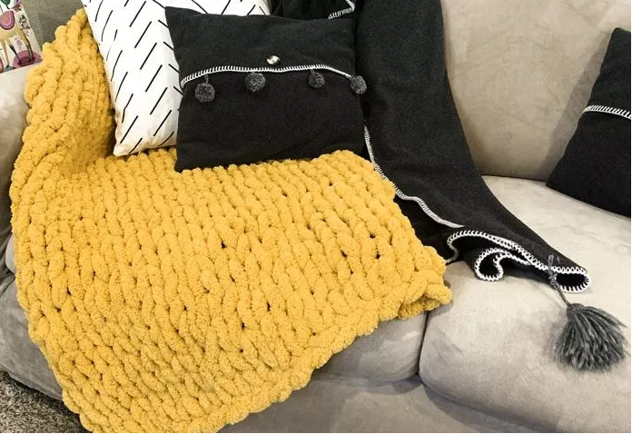 Hand knitted yellow blanket