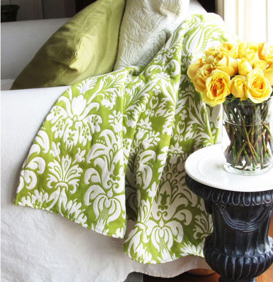 Fabric throw blanket that has a classic flower pattern on it