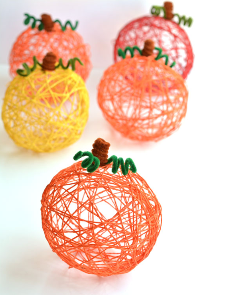 how to make yarn pumpkins using balloons fall holiday craft for kids