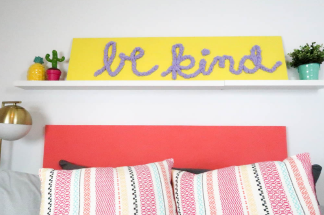 Quote wall art with text saying be kind