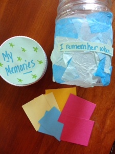 jar decorated with tissue paper and 100 papers in it with a memory written on each one