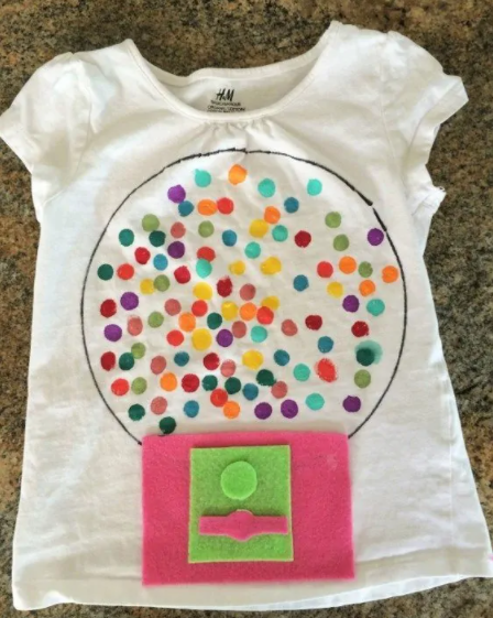 tshirt with felt gumball machine and 100 gumballs painted on