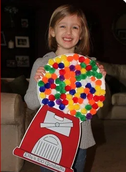 paper and cardstock gumball machine with 100 pompoms as gumballs