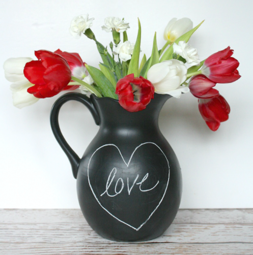 Chalkboard pitcher with the word love inside a heart