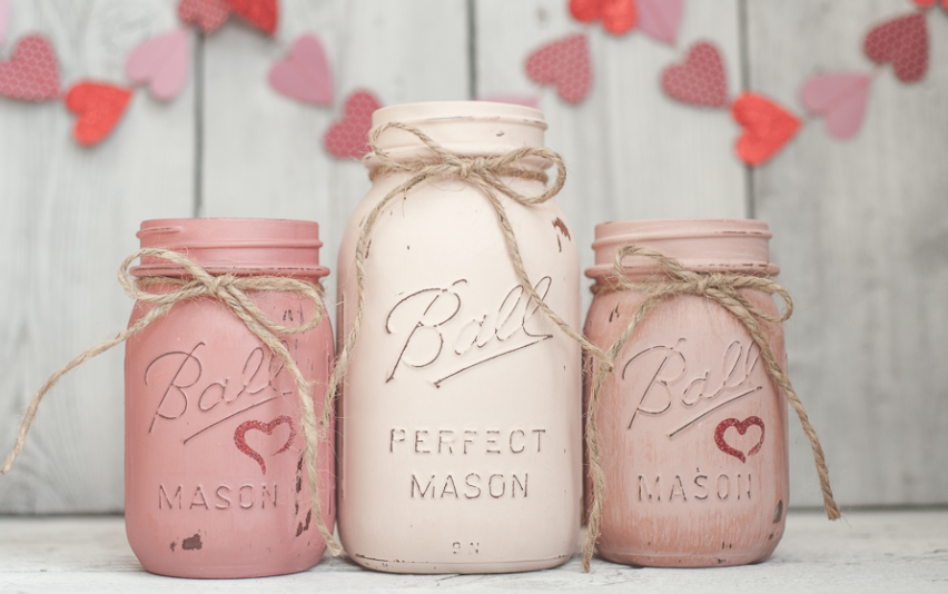 Painted mason jars with a ribbon 