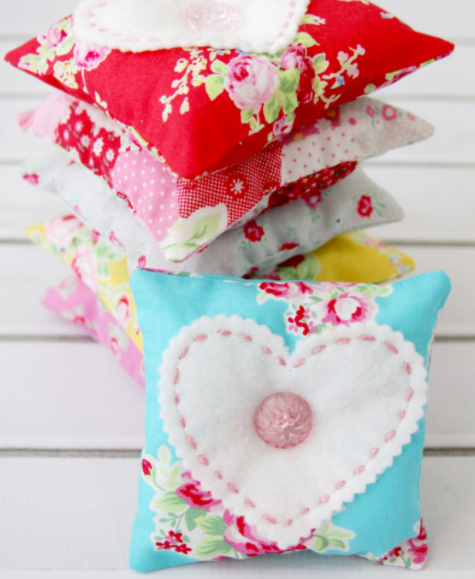 felt and fabric sachets with hearts and buttons on them