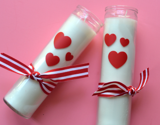 DIY Valentine's Day candles with hearts and bows on them