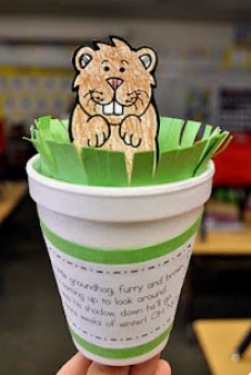 paper groundhog popping out of styrofoam cup 