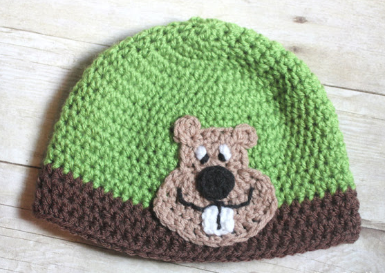crocheted beanie cap with crocheted groundhog applique