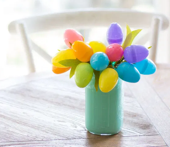 Funky modern Easter egg bouquet on a color light green vase